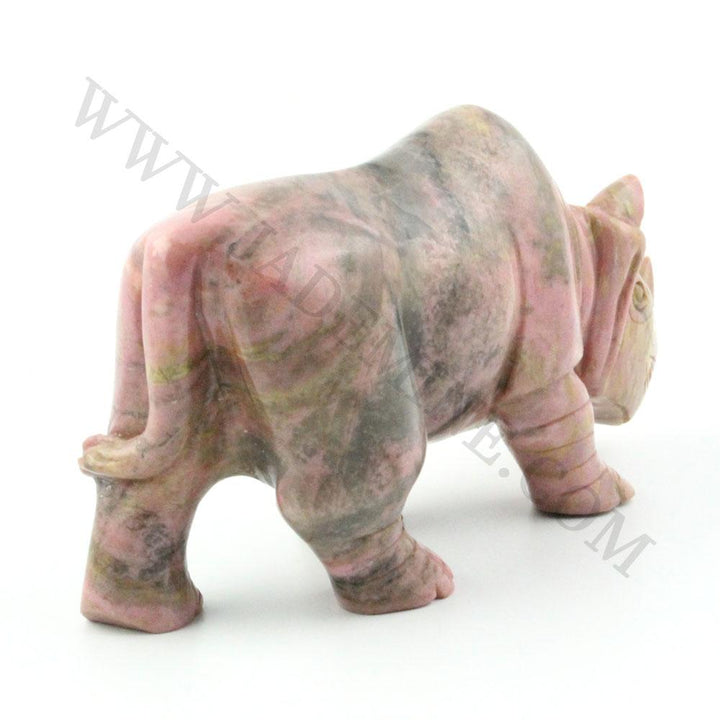 5 inch Rhodonite rhinoceros sculpture with pink gray marbling shown from the left side.