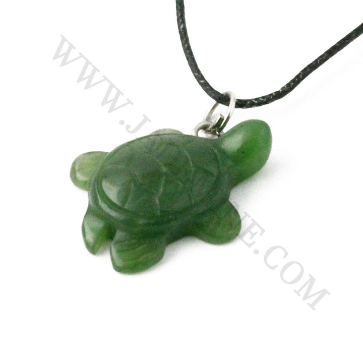 Green jade turtle pendant on a black cord necklace