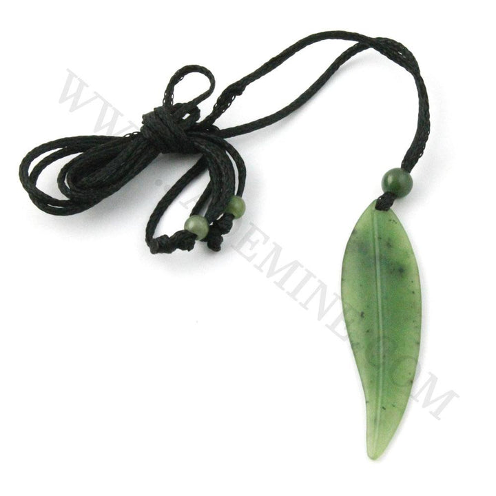 Green jade leaf pendant on a knotted black cord necklace with a small round bead near the top