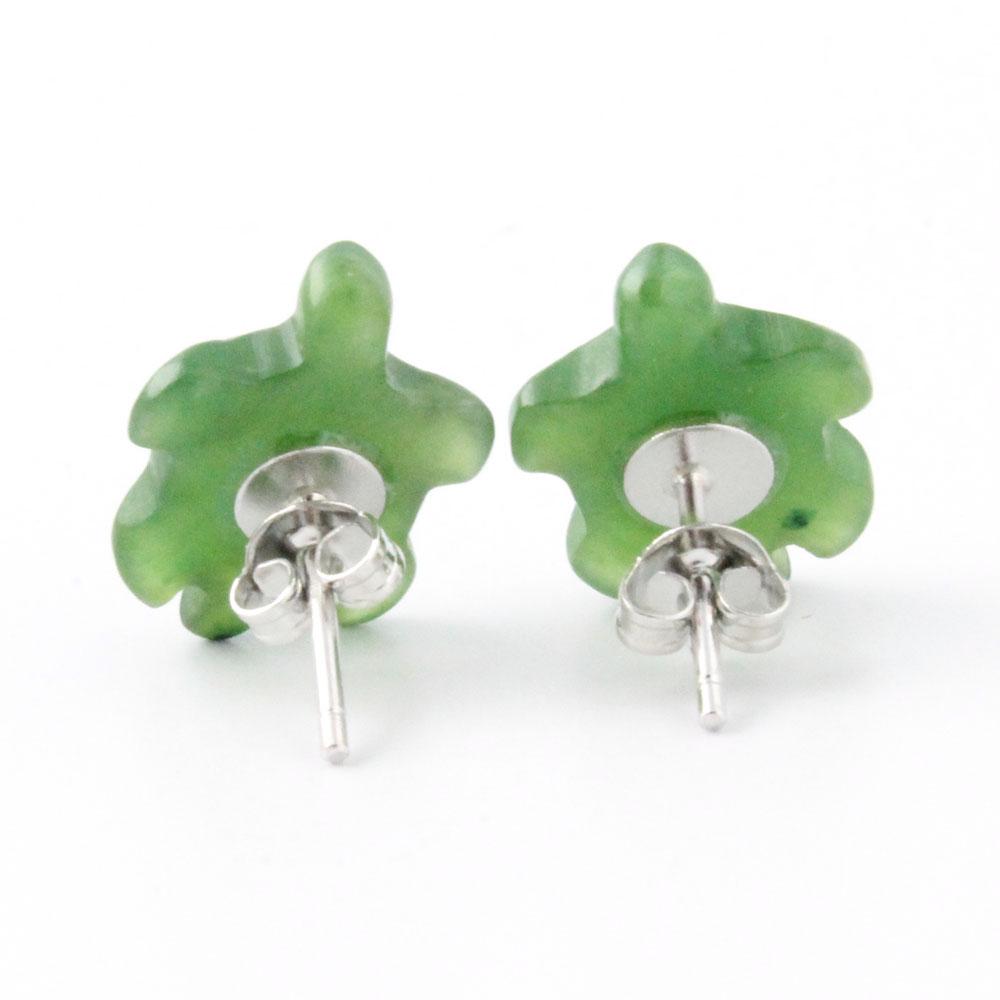 Front view of translucent green turtle shaped earrings with shell pattern against a white background