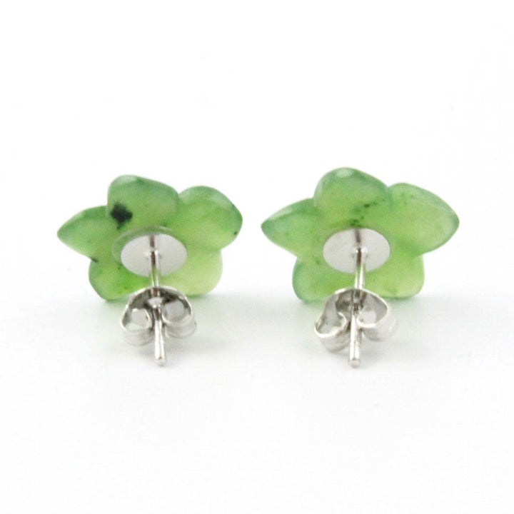 Green jade flower stud earrings with silver posts on a white background