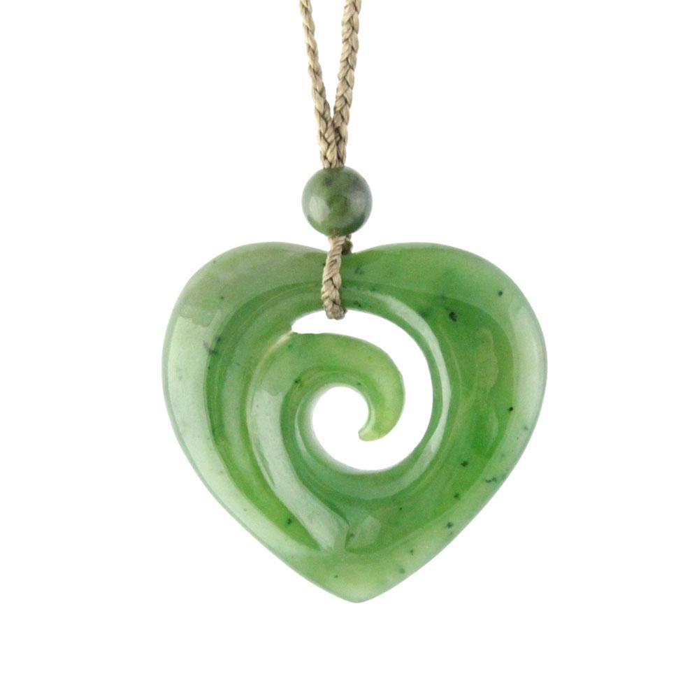 Green jade spiral heart pendant on a brown cord, white background