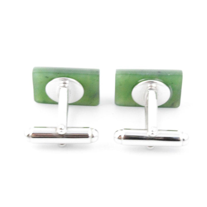 Back view of jade cufflinks with square green fronts and silver stems with ball end fasteners.