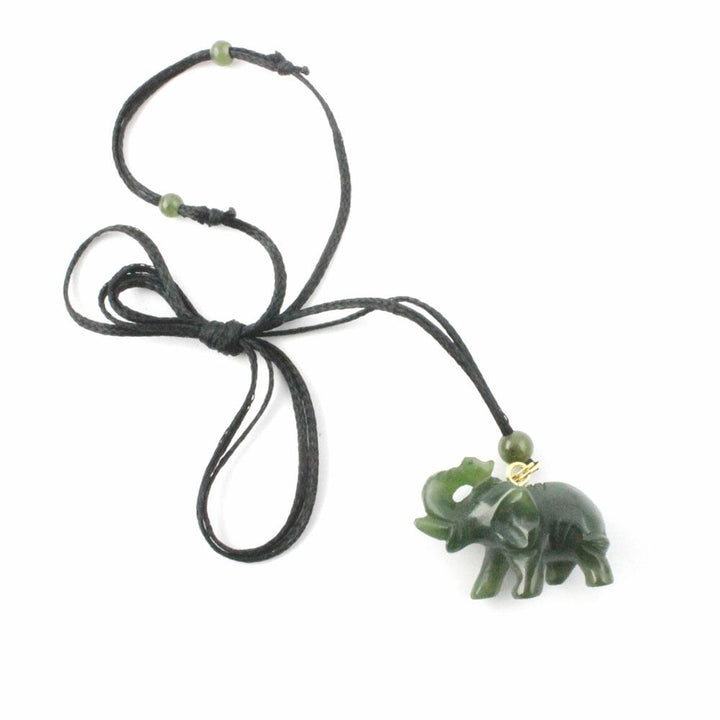 Green jade elephant pendant on a black cord necklace with green bead accents