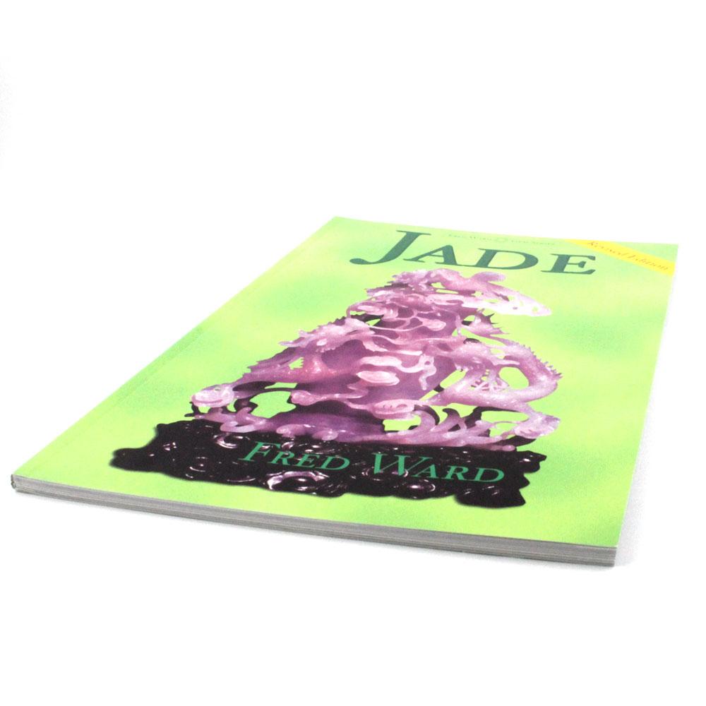 Jade Book with bright lime cover featuring a purple carved sculpture