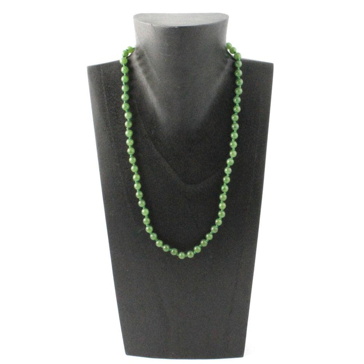 Green 6mm Canadian jade bead necklace on a black display bust.