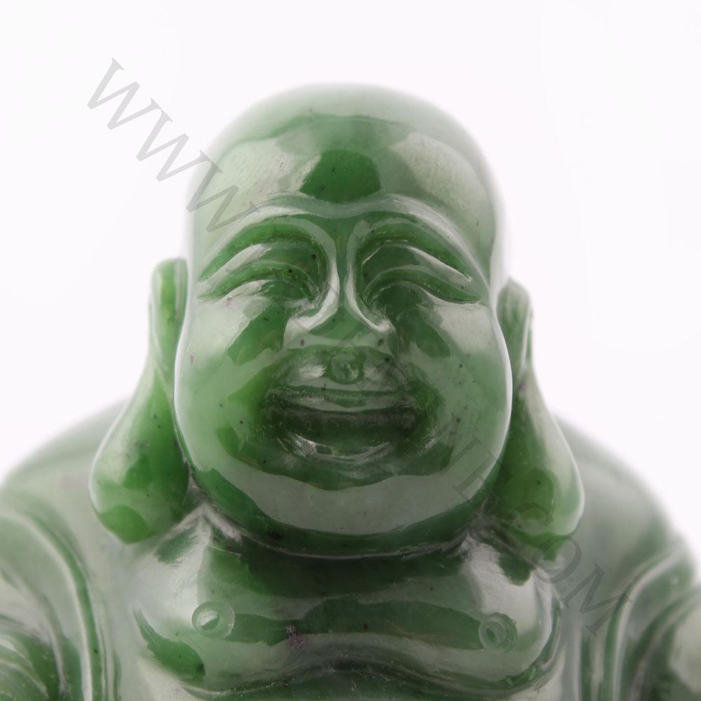 Close-up of green jade Laughing Buddha with a joyful smile