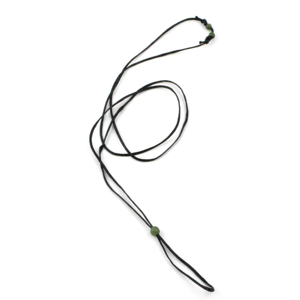 Waxed black cord necklace featuring a green jade bead at the end and small green beads at the top.