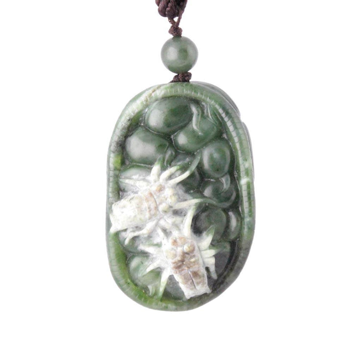 Green jade Spider Hand Held Pendant featuring a white flower carving inside a teardrop shape