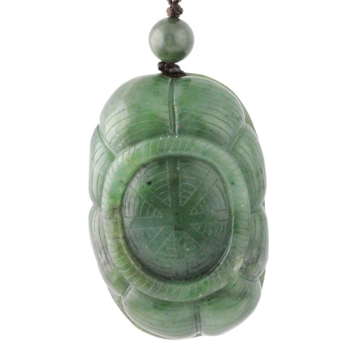 Green jade Spider Hand Held Pendant on a brown cord with a small bead at the top
