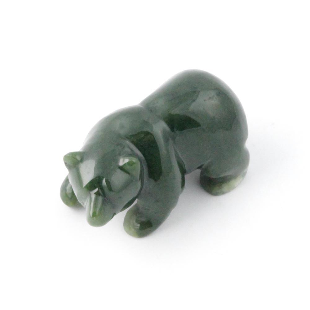 Top down view of a dark green jade bear with rounded back and short legs