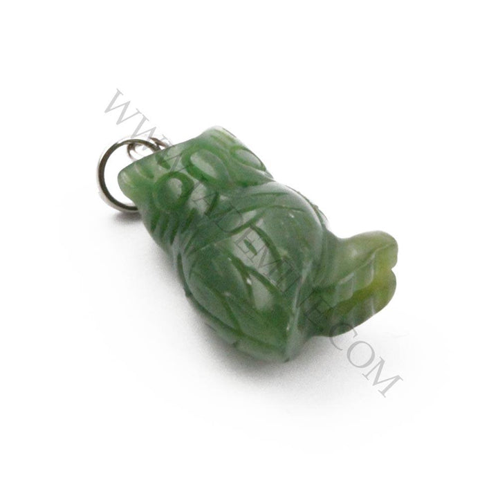 Green jade owl charm with a gold ring bail angled to highlight carved details