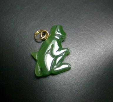 Green jade monkey on a black background 
