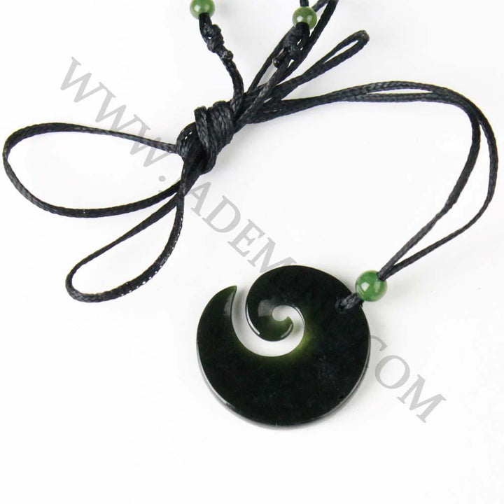 Dark Green/black jade spiral on a white background, with www.jademine.com watermarked on top