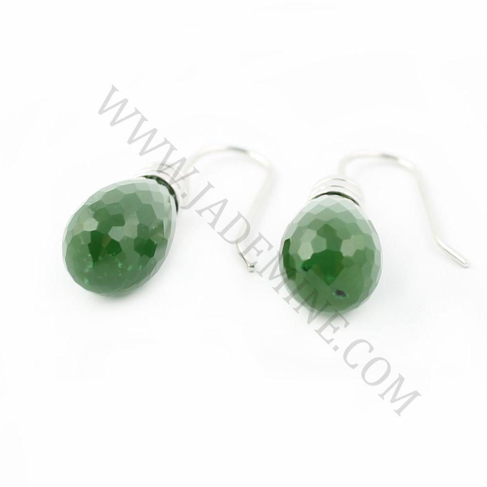 Close up of green teardrop faceted gemstone earrings with silver caps and ear wires