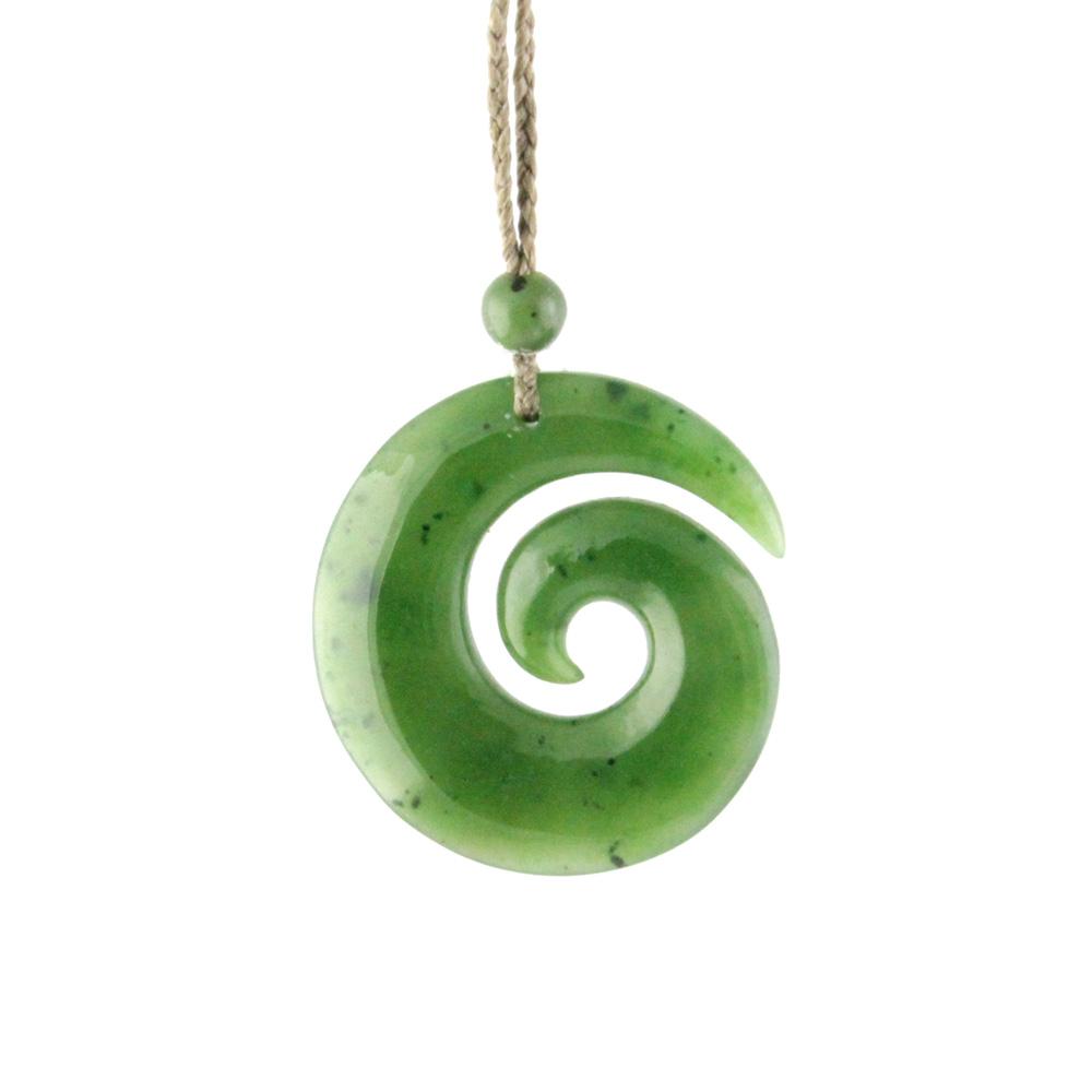 Green jade koru pendant on a natural cord with a small bead above