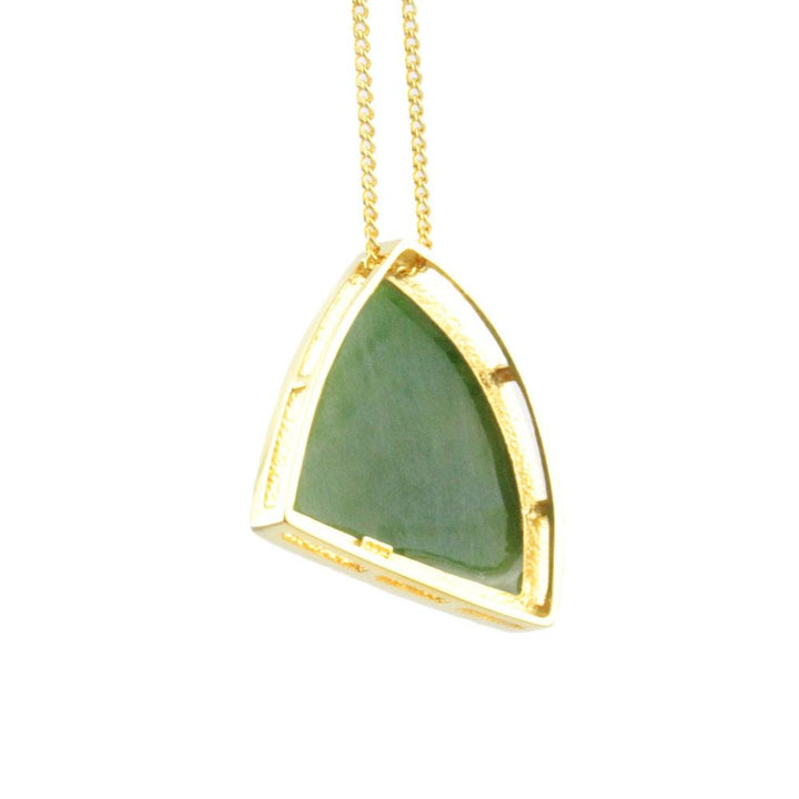 Gold pendant necklace with a green triangular stone set in a bezel