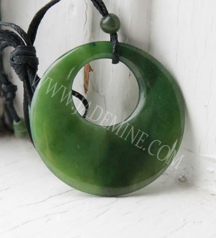Circle jade pendant 37.5mm on black cord with a small bead