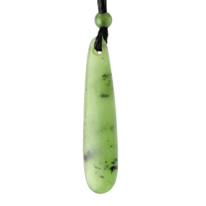 Pale green jade drop pendant with top hole against a white background