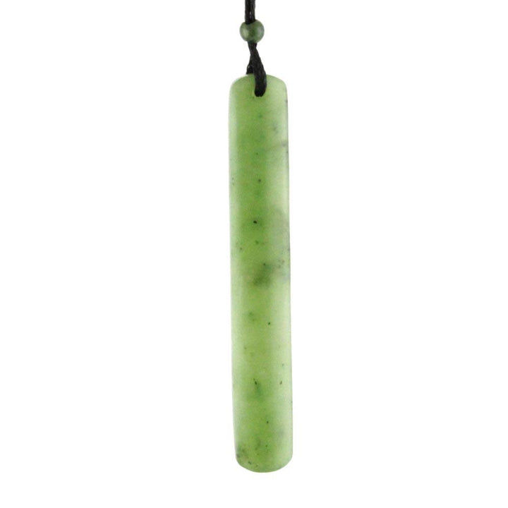 Cylindrical green jade pendant on a black cord with a small green bead