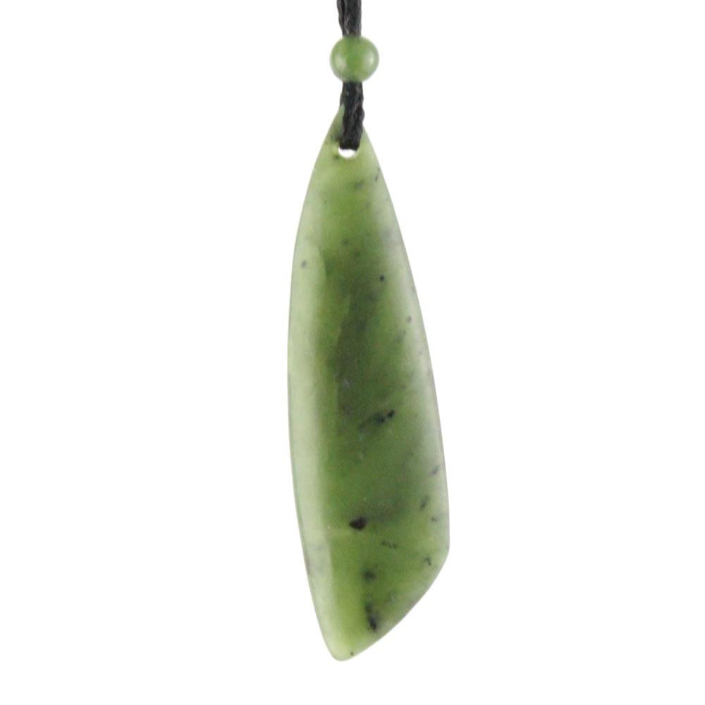 Elongated pale green jade pendant on a black cord with a small green bead above the loop
