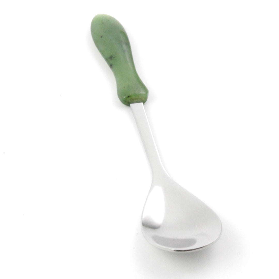 Close up of green jade handle and stainless steel neck of Jade sugar spoon