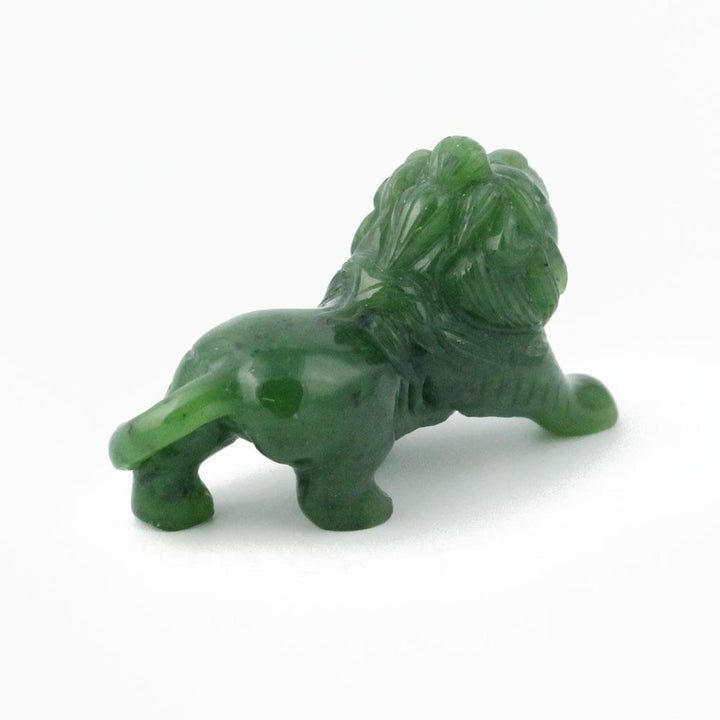 Green stone lion figurine seen in side profile with mane