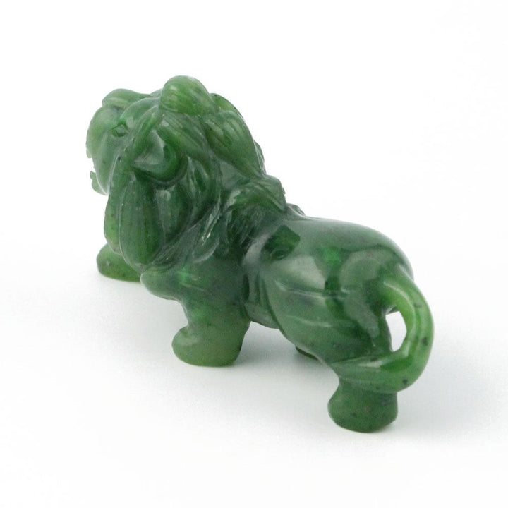 Small green lion figurine with flowing mane and curled tail