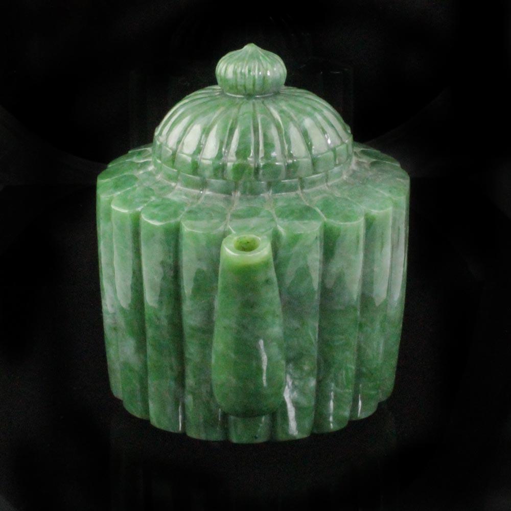 Jade teapot with vertical ribbing and a domed lid viewed from the front