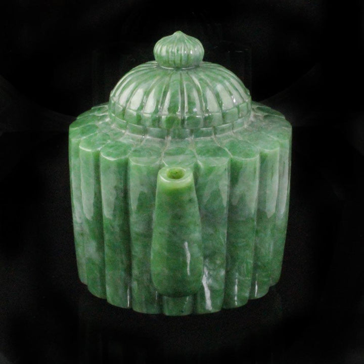 Jade teapot with vertical ribbing and a domed lid viewed from the front