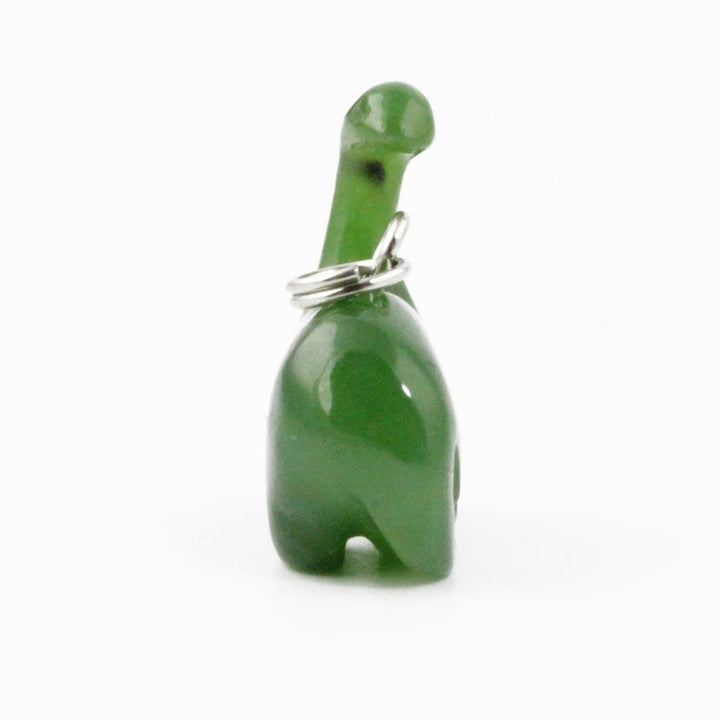 Side view of a green long neck dinosaur charm with a metal loop