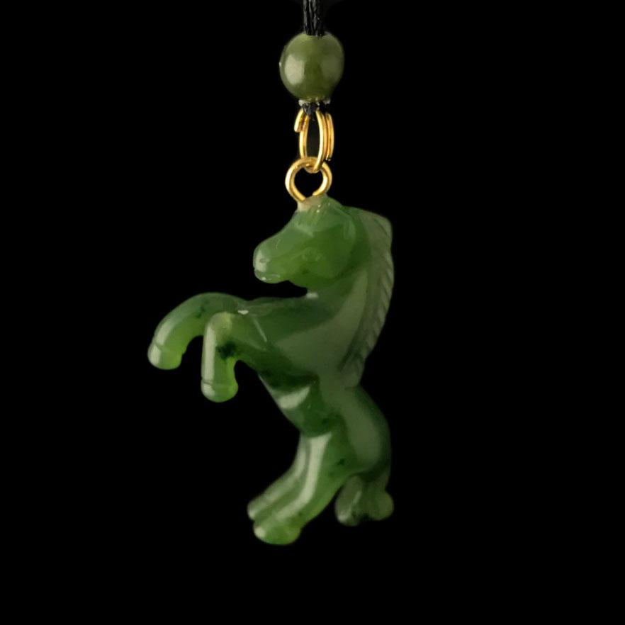 Green Jade Horse Pendant on a black background