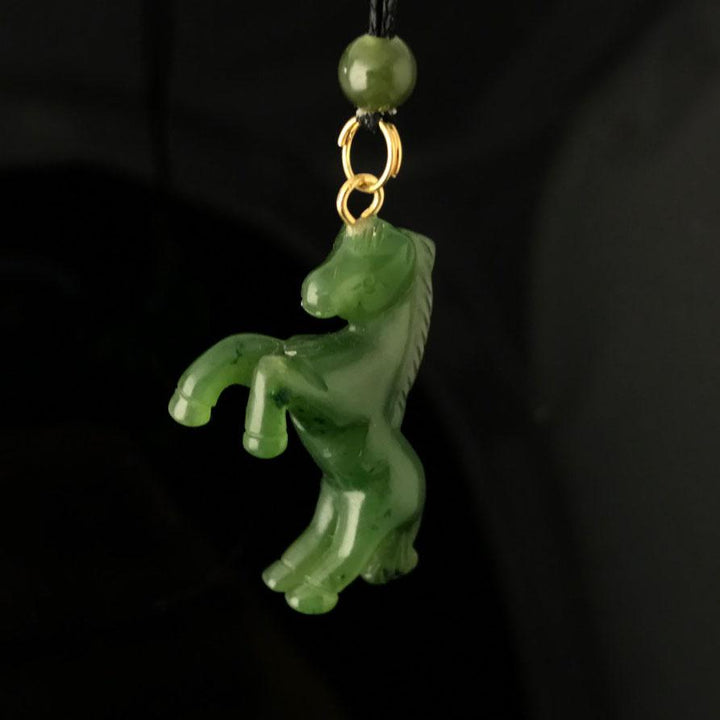 Green Jade Horse Pendant on a black background
