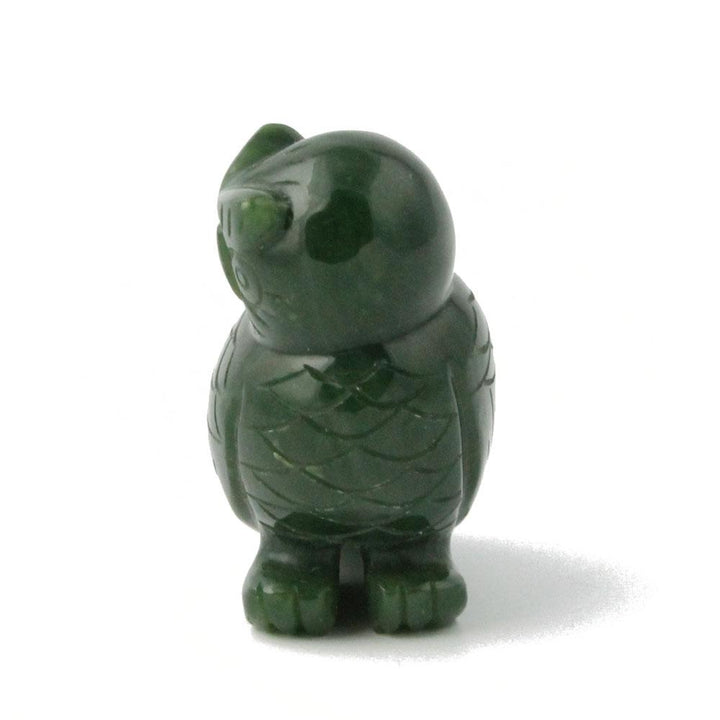 Side profile of dark green jade owl figurine showing sculpted feathers.