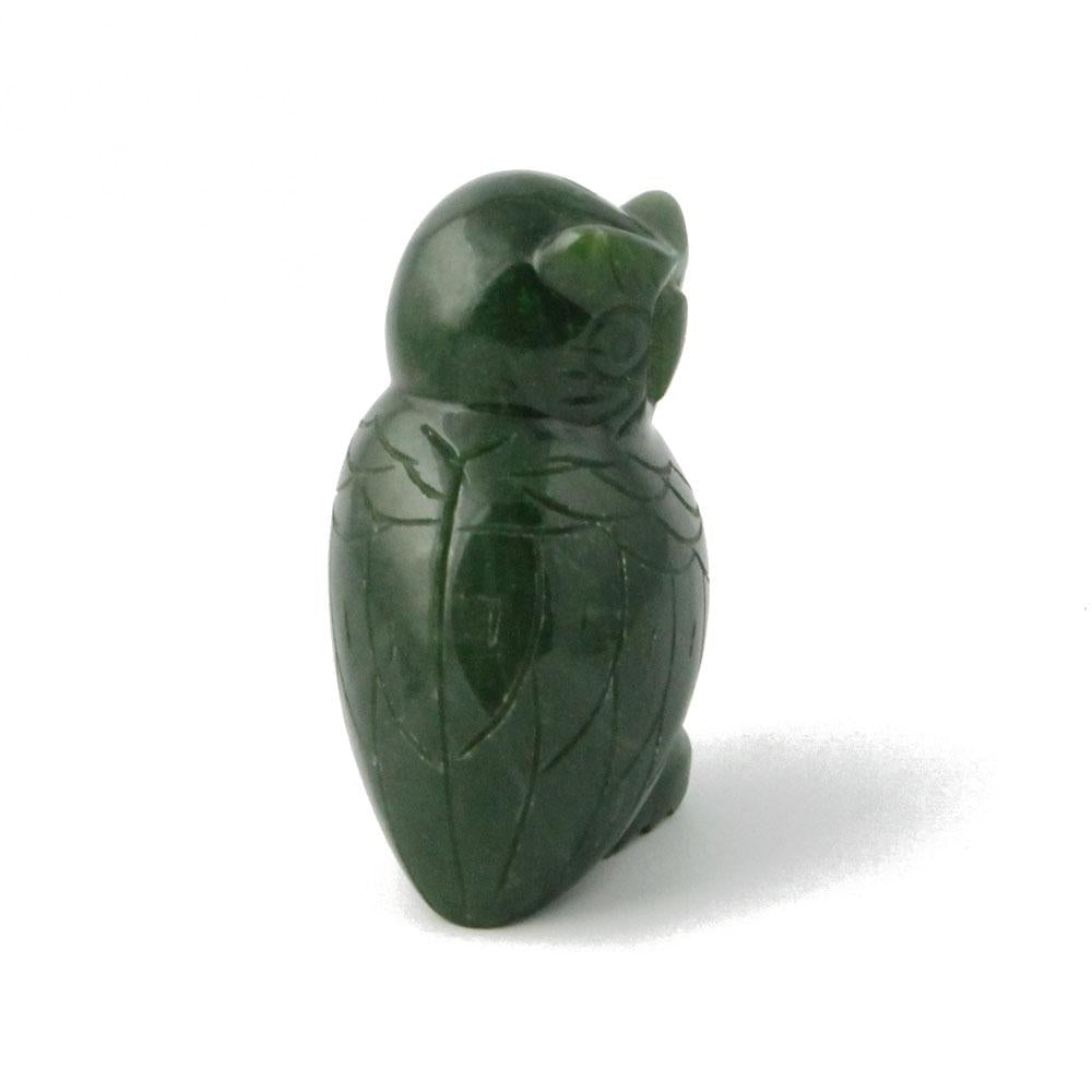 Back view of dark green jade owl figurine with carved wing lines.