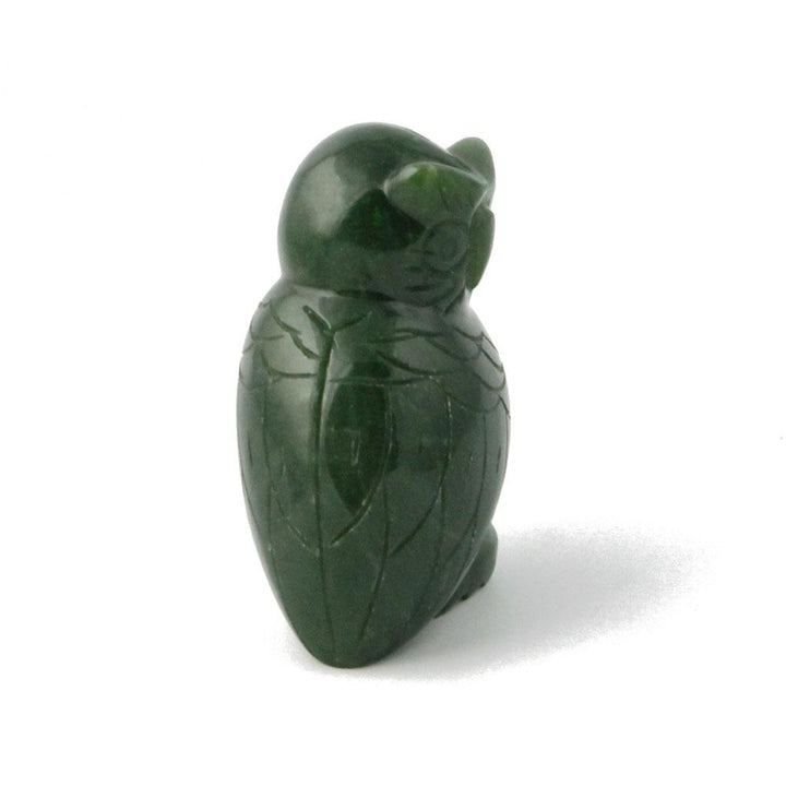Back view of dark green jade owl figurine with carved wing lines.