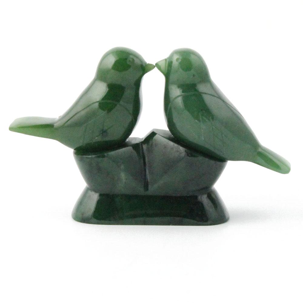 Green jade lovebirds on a white background