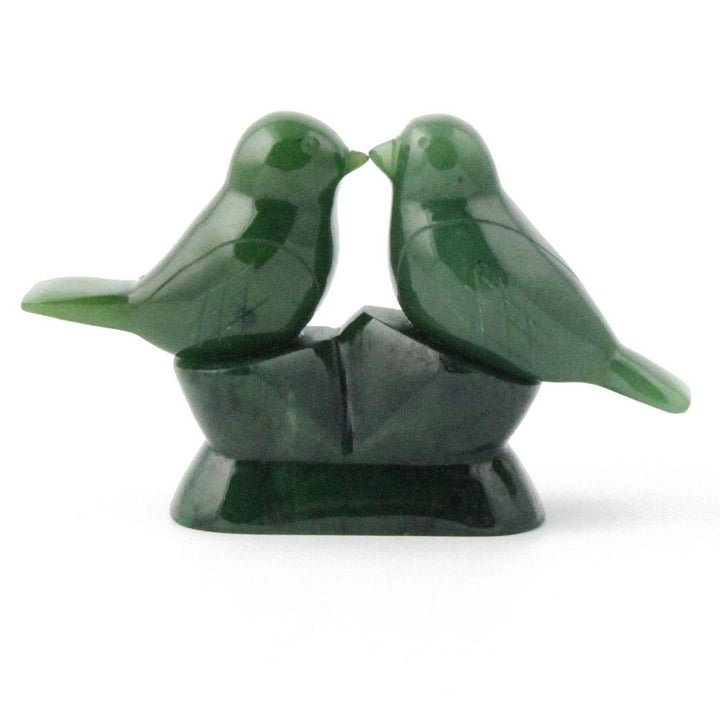 Green jade lovebirds on a white background