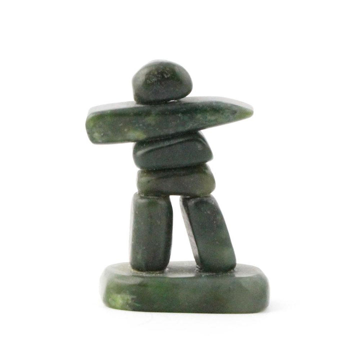 Small green stone Inukshuk with a horizontal rock arm and a rounded head.