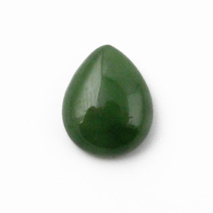 Close up of a single green pear shaped cabochon 9x11mm