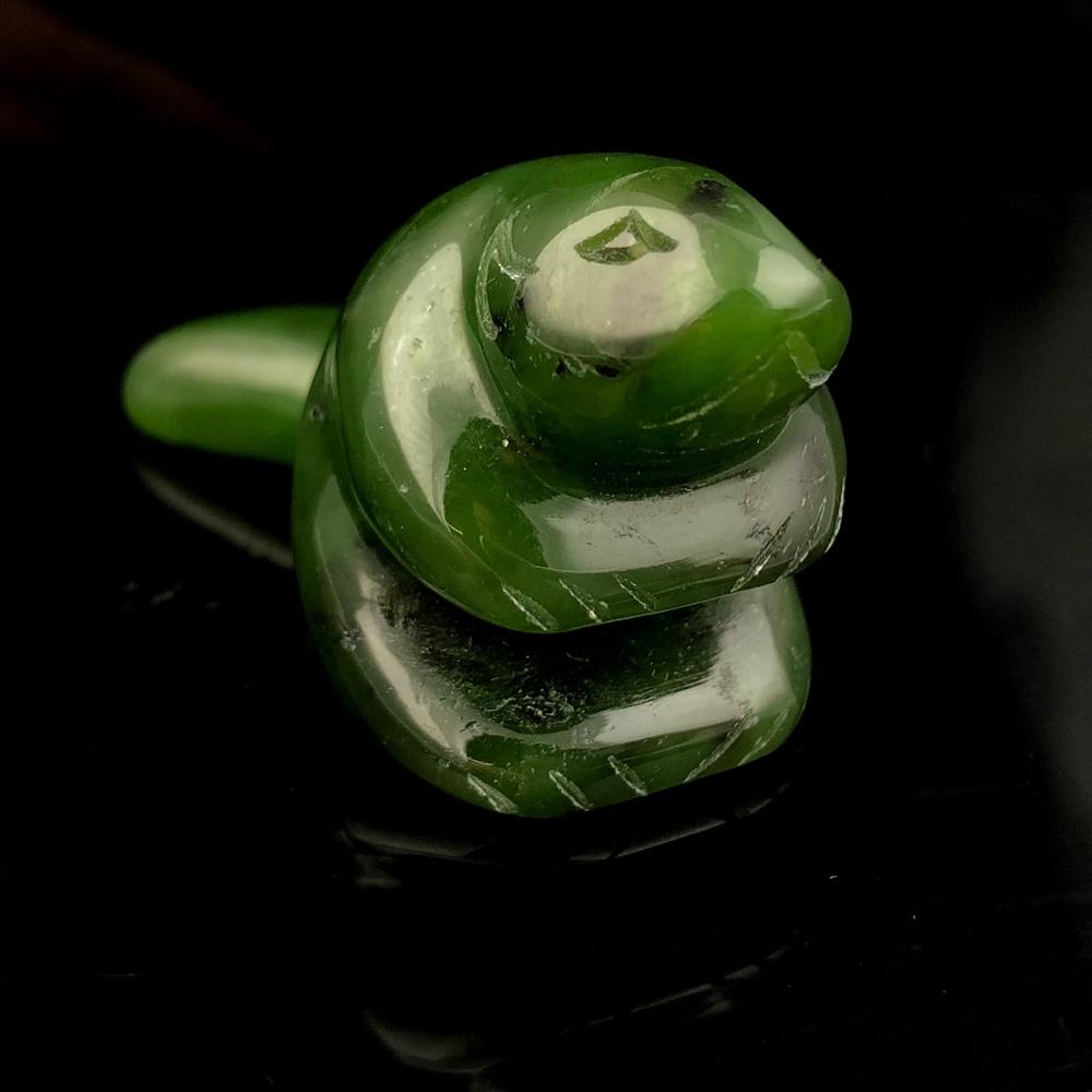 Canadian nephrite jade beaver pendant carved from green jade, 2 inches long.