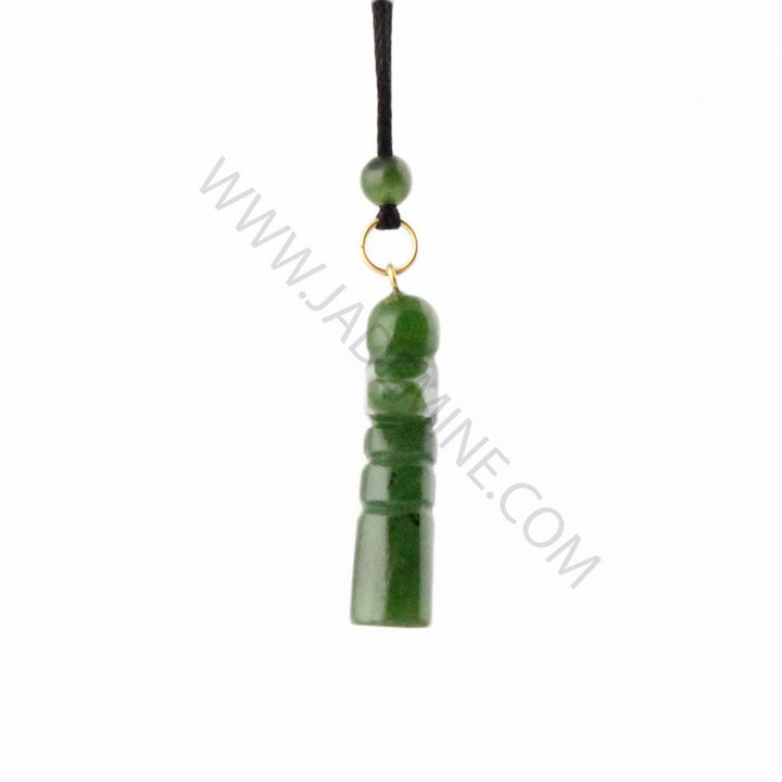 Green jade Inukshuk pendant on a black cord with a small bead and gold loop