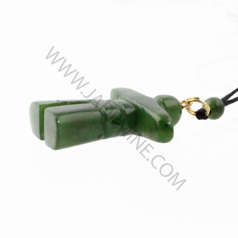 Side view of green jade Inukshuk pendant showing stacked stone segments and gold connector on the cord