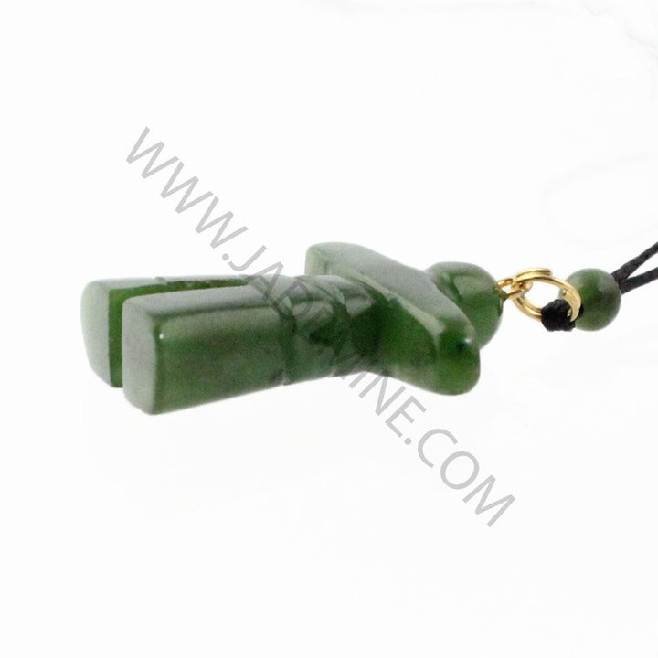 Side view of green jade Inukshuk pendant showing stacked stone segments and gold connector on the cord