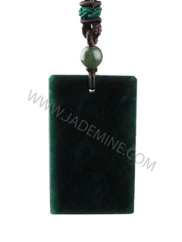Dark green rectangular jade pendant hanging from braided cord with a green bead above.