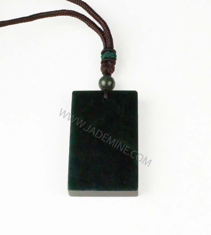Dark green rectangular jade pendant on a brown cord with a green bead above it.
