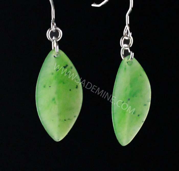 Two green leaf shaped stones forming dangling earrings with silver ear wires