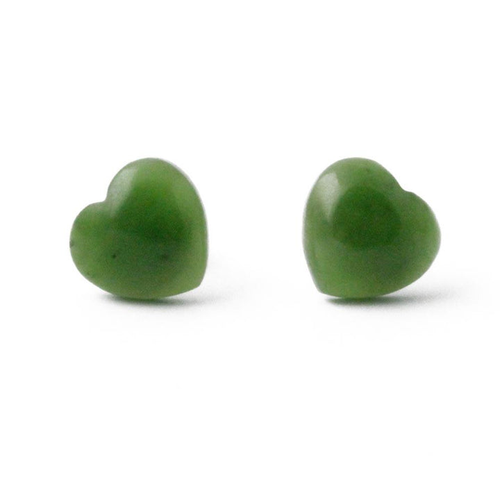 Two green jade heart stud earrings with metal posts visible from behind