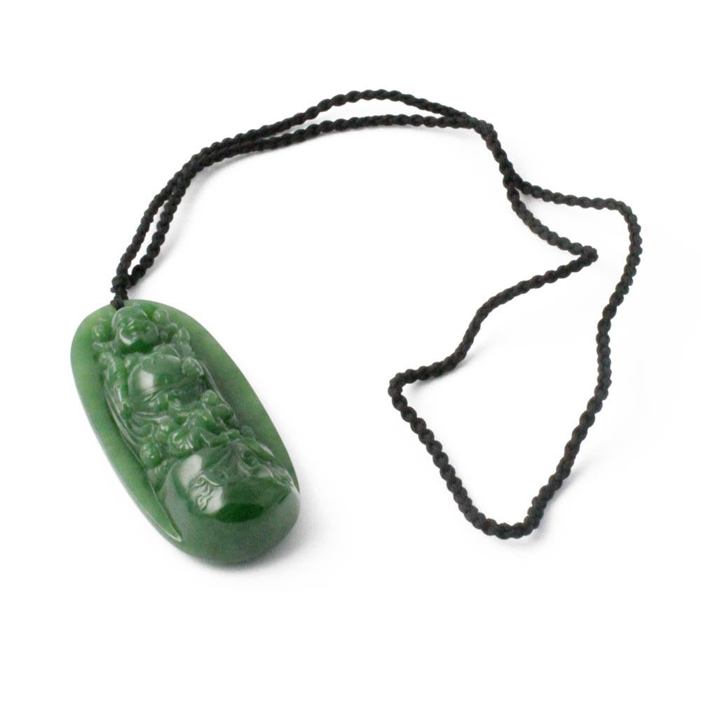 Oval green Siberian jade Buddha pendant on a black braided cord