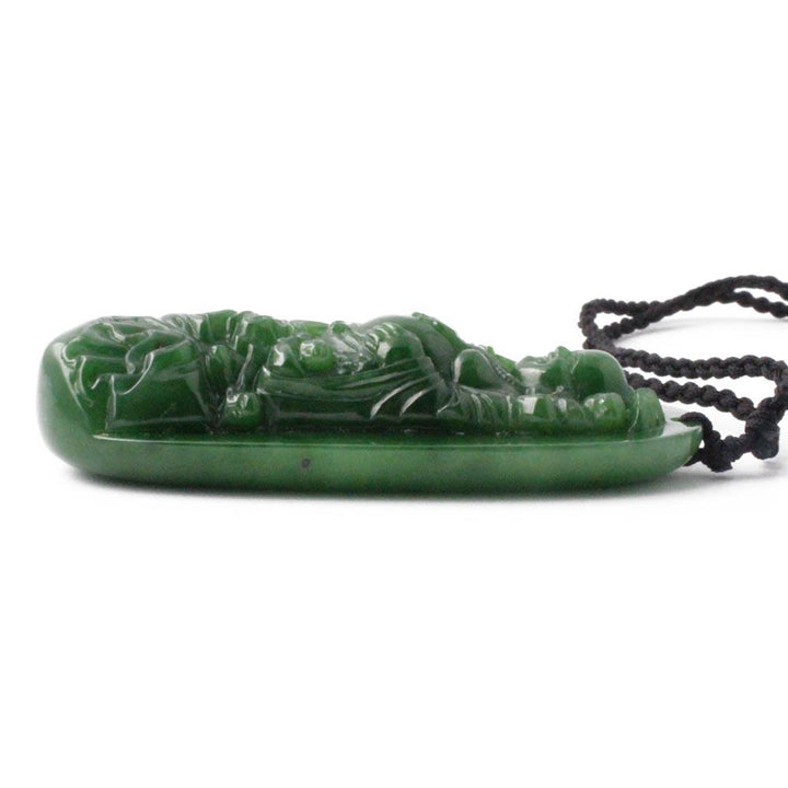 Side view of green jade Buddha pendant on a black cord necklace